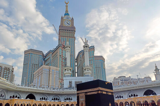 Makkah, Saudi Arabia - December 14, 2024: View of the Kaaba during the day with the Clock Tower in the background