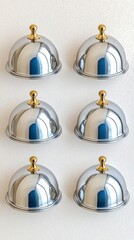 A photostock of polished silver cloche domes used for food service, arranged symmetrically on a clean white background, sleek and professional, High Quality
