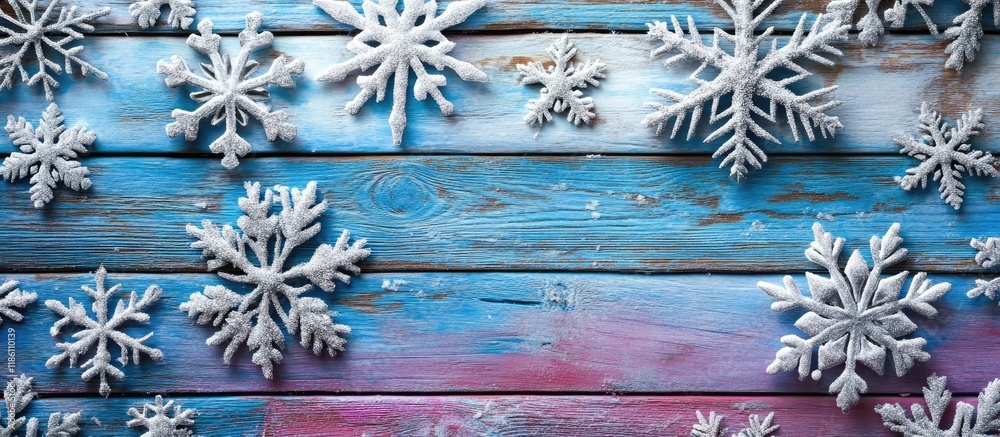 Aufkleber Wooden background featuring silver snowflakes set against a blue and purple backdrop New Year Christmas background texture. with copy space image. Place for adding text or design