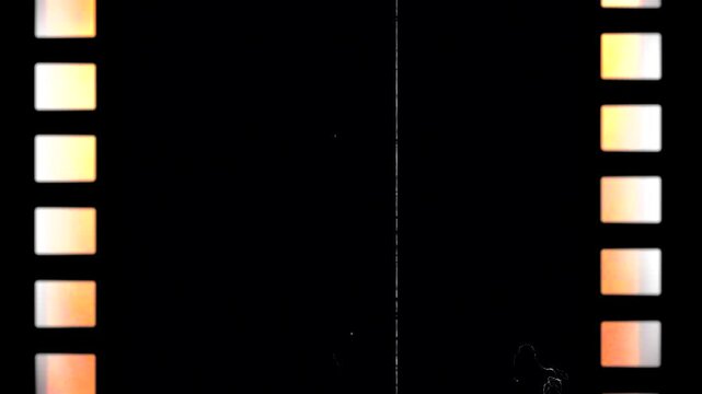 Running Black Film Strip Loop Background With Scratches