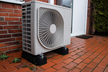 An electrical air conditional system heat pump outside of the building 