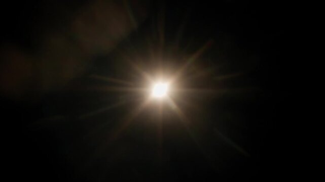 Real optical lens flare on black background
