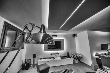 Modern lounge-style basement with dynamic strip LED lights and unique light games