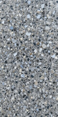 Close-up of a textured concrete surface with various aggregate stones.