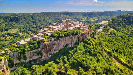 Panoramic aerial view of Civita di Bagnoregio from a flying drone around the medieval city, Italy.