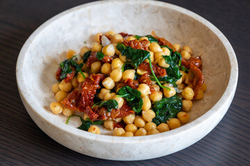 Healthy Salad with Chickpeas, Sun-Dried Tomatoes, and Spinach Close-Up