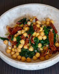 Healthy Salad with Chickpeas, Sun-Dried Tomatoes, and Spinach Close-Up