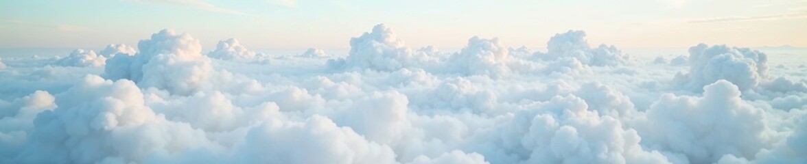 Fototapeta premium A sea of soft white cumulus clouds blankets the landscape, hazy, atmosphere