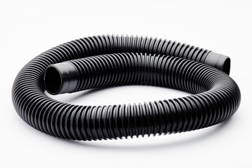 Close-up view of black ribbed flexible plastic hose, commonly used in vacuum cleaners, plumbing,...