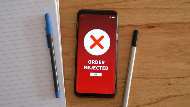 Order rejected notification on smartphone. Concept of problems at online checkout.
