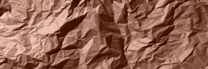 Fototapeta premium Brown, mocha mousse crumpled, wrinkled recycle craft paper texture background banner