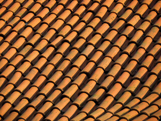 Close-up of Traditional Terracotta Roof Tiles in Warm Sunlight, Showing Texture and Pattern