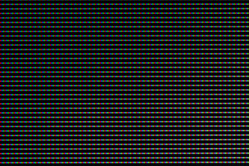 Red, green and blue LEDs on a TV screen close-up. Background of RGB lamps on the screen