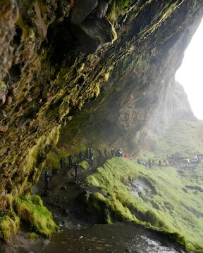 Exploring the Verdant Icelandic Caves Beneath Majestic Cliffs: A Journey into Nature's Hidden Beauty