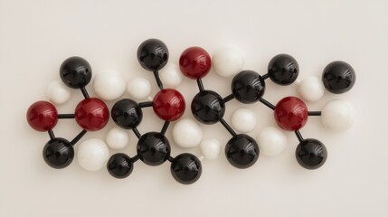 Molecular structure model with red, black, and white spheres on neutral background