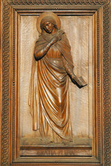 Obraz premium Annunciation to Mary, door of the Papal Basilica of Santa Maria degli Angeli in Assisi, Umbria, Italy