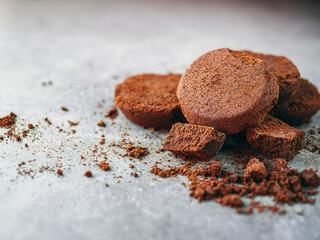Close-up of coffee grounds from espresso machine. coffee ground on gray background