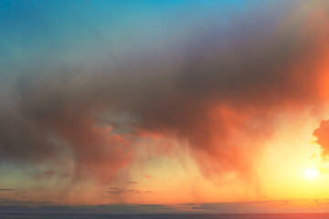 Dramatic colorful evening cloudy sky during sunset