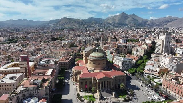 Teatro Massimo in Palermo, Sicily, with surrounding cityscape and mountains in the background. A stunning panorama showing the theater and the charm of the Mediterranean region.