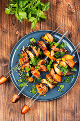 Tasty cooked sweet potato on skewers.