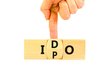 Initial public or DEX offering symbol. Concept words abbreviation IPO or IDO on wooden block....