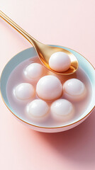 Close-up of a bowl of tangyuan on a clean background