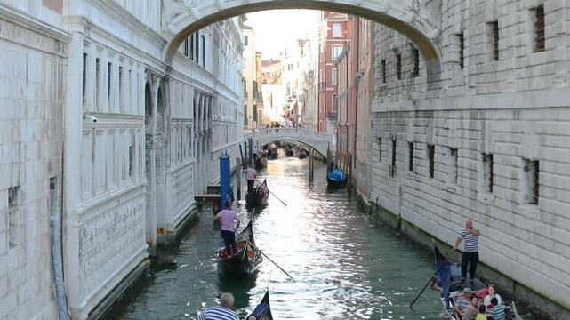 Gandolas floating down a narrow street in Venice, Italy. Bridge of Sighs Venice. Romantic place bridge of sighs