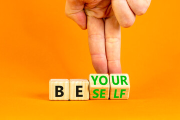 Motivational be yourself symbol. Concept words Be yourself on beautiful wooden block. Beautiful orange background Businessman hand. Business motivational be yourself concept. Copy space.
