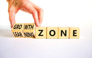 Learning or growth zone symbol. Concept words Learning zone Growth zone on wooden cubes. Beautiful white table white background. Psychologist hand. Business learning growth zone concept. Copy space.