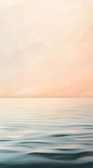 Obraz premium Gentle ripples create a mesmerizing pattern on the water's surface, reflecting the soft pastel hues of the sunset sky, creating a serene and tranquil atmosphere