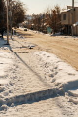 uncleaned roads after a winter snowfall in Kazakhstan. highway covered with sticky snow in Shymkent