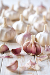fresh garlic on a white wooden table, selective focus.