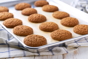 Baking pan with oatmeal cookies , close up.