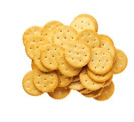 Heap of round salted crackers isolated on white background, top view.