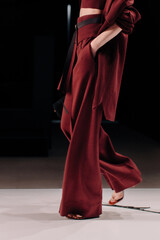 Fashion details of trendy red burgundy sweater, pants and crop top, women's fashion cloth concept...