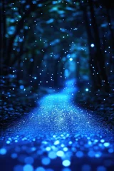Magical blue pathway illuminated by shimmering particles in a forest at night