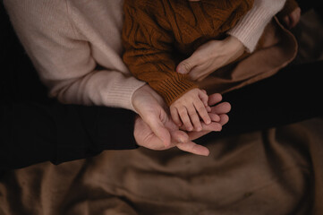 Child and Parent Hands Together