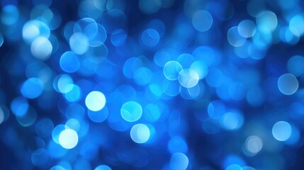 Bright blue abstract bokeh background with soft blurred effect creating a serene and calm atmosphere for creative design projects.