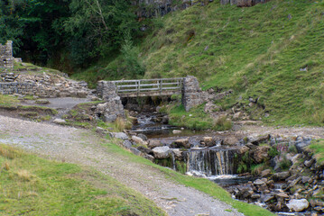 Footbridge at Fair Yew End in the Swinner Gild, which is a wild and remote area in the Swaledale in the Yorkshire Dales National Park.