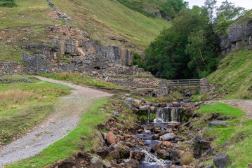 Footbridge at Fair Yew End in the Swinner Gild, which is a wild and remote area in the Swaledale in the Yorkshire Dales National Park.