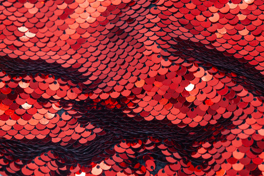 New Year red background Sequins, glitter. Background template made red sequins, glitters, sparkles and paillettes. Luxury poster with sparkling sequins, glitter gradient dots. 