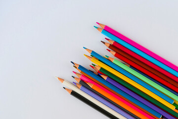 Back to school banner. Colourful pencils for school. White background. Flat lay