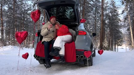 Valentine's Day concept. Happy couple in love with. A  loving couple celebrating Valentine's Day. Lovers give each other gifts. Romance for Valentine's Day- concept.