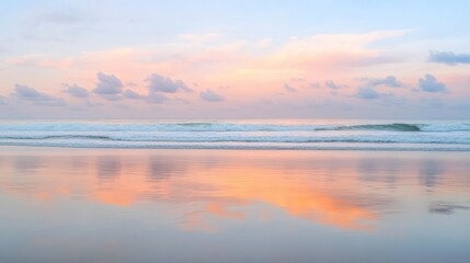 Fototapeta premium Serene ocean with gentle waves and soft pink sunset hues reflecting on calm water surface creating a tranquil coastal scene