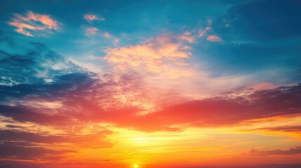 Fototapeta premium Vibrant Colorful Summer Sunset Over Ocean Sky with Dramatic Cloud Formation