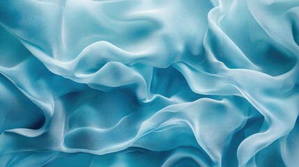 Obraz premium Turquoise silk fabric texture with fluid waves creating an elegant and artistic background design for textiles and fashion applications