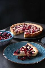 Piece of delicious currant pie and fresh berries on grey table, space for text
