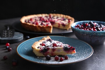 Sprinkling powdered sugar onto piece of delicious currant pie on grey table, closeup