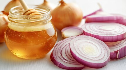 Honey and onion slices arranged on a white surface, showcasing a blend of flavors and colors in a culinary setting suitable for healthy recipes or natural remedies