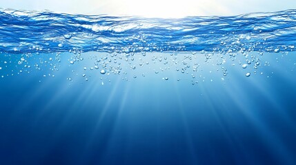 Underwater scene with sunlit surface waves and rising bubbles.